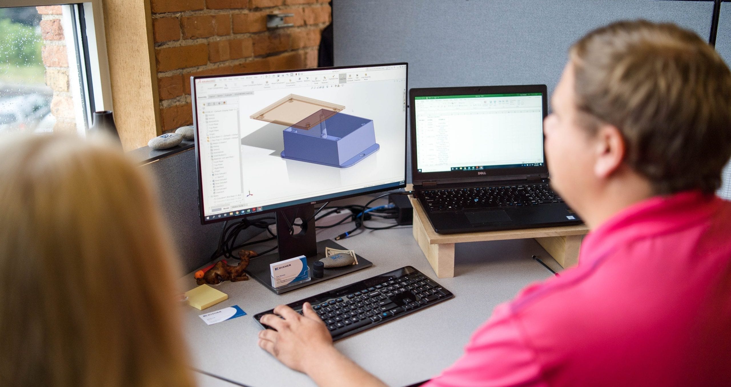 Brennan Proudfit working with a team on CAD Designing.