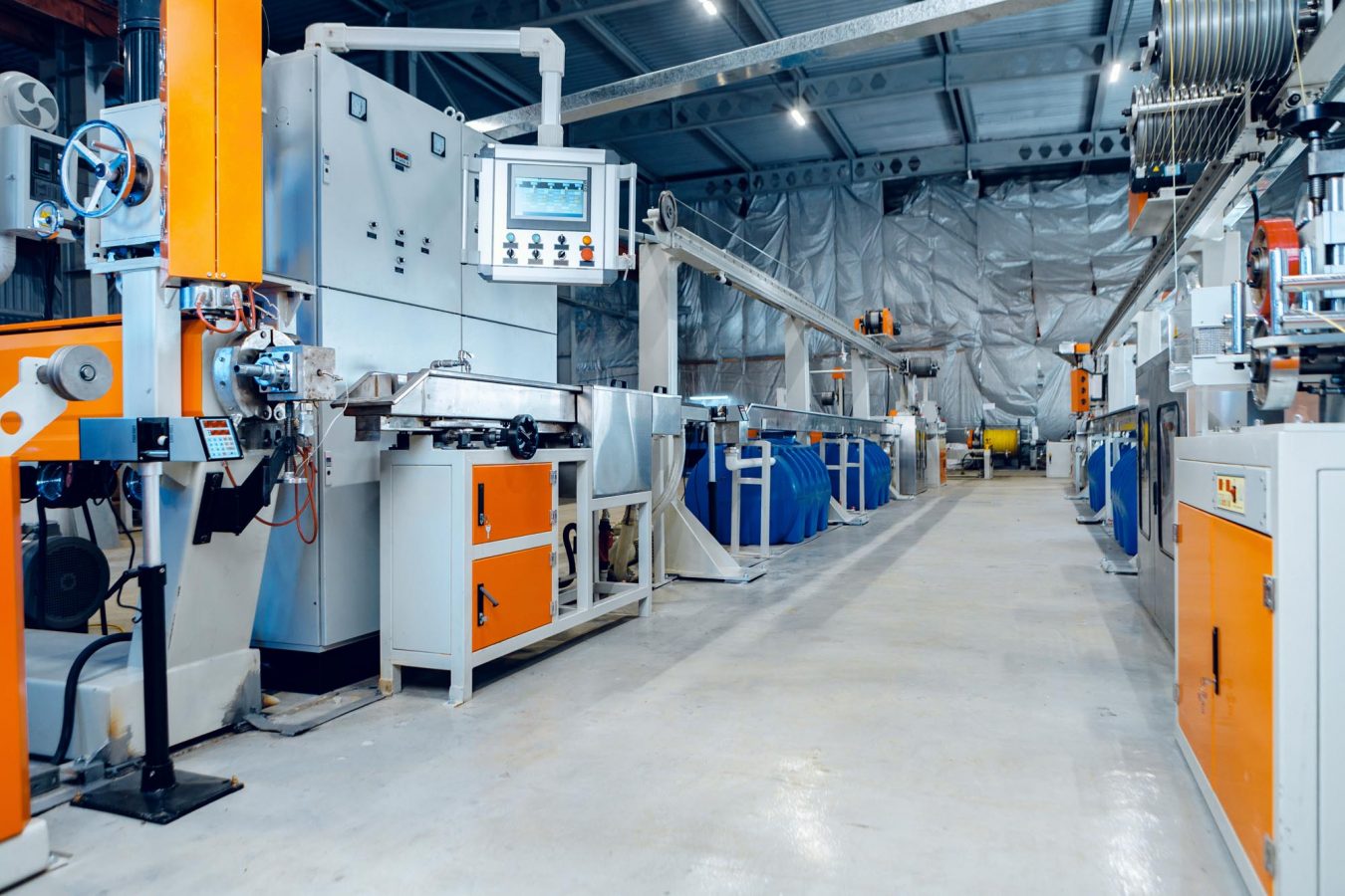 Inside a factory with a controls panel