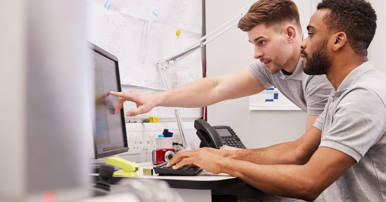 Two Engineers Looking at a Computer