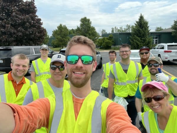DISHER volunteers in high vis vests doing highway clean up