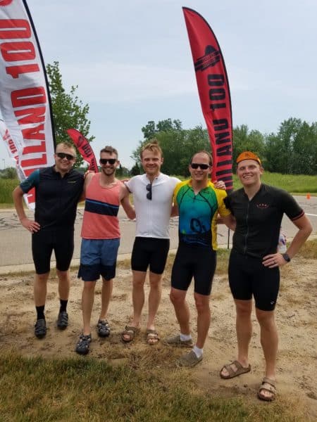Five male DISHER employees posing after running a race