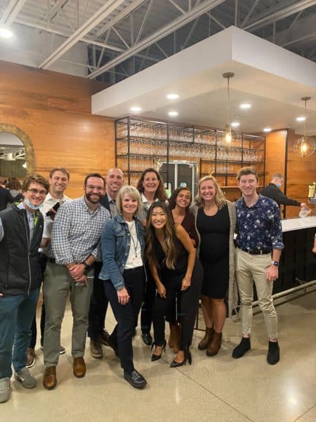 A group of DISHER employees at an event